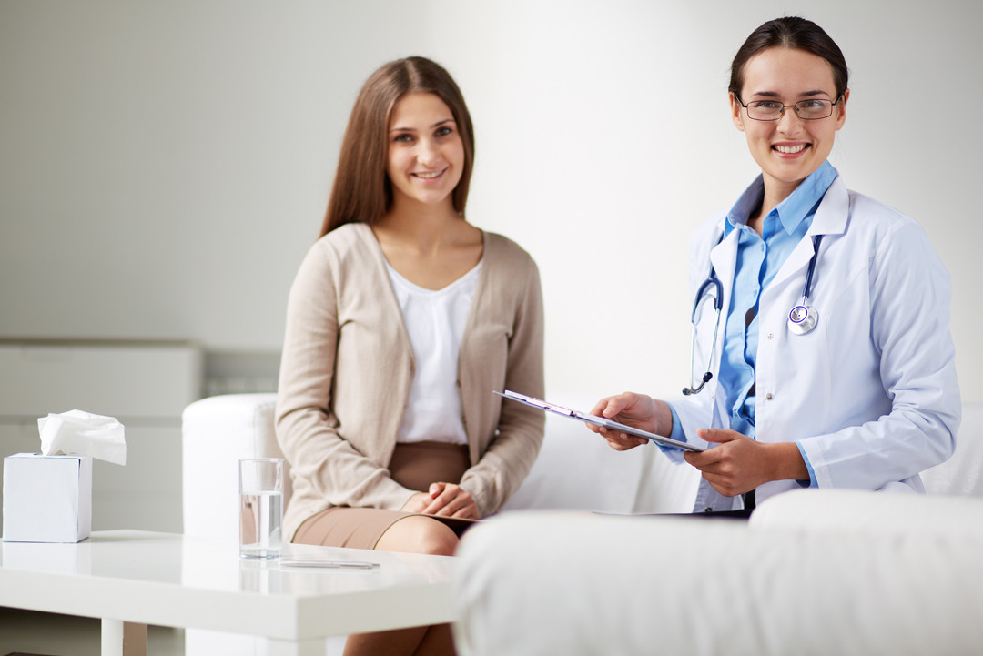 Woman Doctor and Female Patient Talking