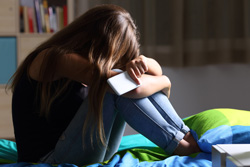 child being cyberbullied